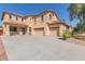 Two-story house with large driveway and desert landscaping at 40752 W Robbins Dr, Maricopa, AZ 85138