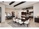 Elegant dining area with a large table and chairs adjacent to the kitchen at 4455 E Quail Brush Rd, Cave Creek, AZ 85331