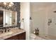 Elegant bathroom with granite vanity, walk-in shower, and patterned wallpaper at 4455 E Quail Brush Rd, Cave Creek, AZ 85331