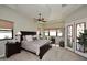 Spacious bedroom with a large bed and access to the ensuite bathroom at 4455 E Quail Brush Rd, Cave Creek, AZ 85331