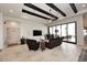 Spacious Gathering room with high ceilings, exposed beams, and sliding glass doors leading to the backyard at 4455 E Quail Brush Rd, Cave Creek, AZ 85331