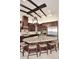 Large kitchen island with seating, granite countertops, and dark wood cabinets at 4455 E Quail Brush Rd, Cave Creek, AZ 85331
