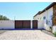 Modern home with double gates and paved driveway at 4455 E Quail Brush Rd, Cave Creek, AZ 85331