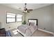 Bright bedroom with large windows and ceiling fan at 4455 E Quail Brush Rd, Cave Creek, AZ 85331