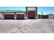 Three-car garage with wood doors and gated side access at 4455 E Quail Brush Rd, Cave Creek, AZ 85331