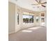 Living room with pool and backyard view at 18195 W Redwood Ln, Goodyear, AZ 85338