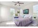 Serene bedroom with large windows and ceiling fan at 12075 N San Clemente St, Surprise, AZ 85388