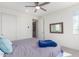 Cozy bedroom with sliding door closet and ceiling fan at 12075 N San Clemente St, Surprise, AZ 85388