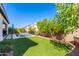 Lush backyard with a sparkling pool and patio umbrella at 12075 N San Clemente St, Surprise, AZ 85388