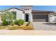 Single-story home with a two-car garage and landscaped yard at 12075 N San Clemente St, Surprise, AZ 85388