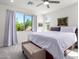 Spacious primary bedroom with large windows and plush bedding at 12075 N San Clemente St, Surprise, AZ 85388