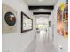 Long hallway with view into living room and kitchen areas at 12075 N San Clemente St, Surprise, AZ 85388