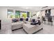 Spacious living area with comfortable sectional sofa and view into kitchen at 12075 N San Clemente St, Surprise, AZ 85388