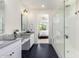 Elegant bathroom featuring a large walk-in shower and double vanity at 12075 N San Clemente St, Surprise, AZ 85388