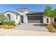 Single-story home with a two-car garage and landscaped yard at 12075 N San Clemente St, Surprise, AZ 85388