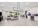 Open floor plan showcasing a spacious living room and modern kitchen with island at 12075 N San Clemente St, Surprise, AZ 85388