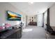 Spacious home office with a desk, piano, and large TV at 13110 W Denton St, Litchfield Park, AZ 85340