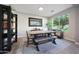 Dining area with table, bench seating, built-in shelving, and large window at 13110 W Denton St, Litchfield Park, AZ 85340