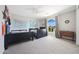 Bedroom with two twin beds, a dresser, and a window offering backyard views at 13110 W Denton St, Litchfield Park, AZ 85340