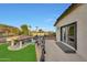 A relaxing backyard with a pool, pergola, and grassy area at 13110 W Denton St, Litchfield Park, AZ 85340