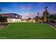 Spacious backyard with putting green and large grassy area at 13110 W Denton St, Litchfield Park, AZ 85340