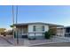 Mobile home with covered parking and desert landscaping at 11411 N 91St Ave # 217, Peoria, AZ 85345