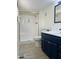 Updated bathroom with a separate shower and a navy vanity at 11411 N 91St Ave # 217, Peoria, AZ 85345