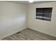 Simple bedroom with wood-look floors and window coverings at 11411 N 91St Ave # 217, Peoria, AZ 85345