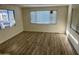 Living room with laminate wood flooring and open kitchen at 11411 N 91St Ave # 217, Peoria, AZ 85345