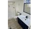 Bright bathroom featuring a walk-in shower and new vanity at 11411 N 91St Ave # 217, Peoria, AZ 85345