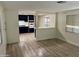 Living room with laminate flooring and open kitchen at 11411 N 91St Ave # 217, Peoria, AZ 85345
