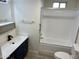 Clean bathroom with a tub, sink, and toilet at 11411 N 91St Ave # 217, Peoria, AZ 85345