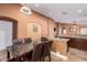 Kitchen with granite-top island and dark wood cabinets at 8714 W Heber Rd, Tolleson, AZ 85353