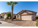 Single-story home with attached garage and desert landscaping at 8714 W Heber Rd, Tolleson, AZ 85353