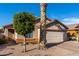 Single-story home with attached garage and desert landscaping at 8714 W Heber Rd, Tolleson, AZ 85353