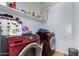 Laundry room with washer, dryer, and shelving at 8714 W Heber Rd, Tolleson, AZ 85353