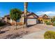 Single-story home with attached garage and desert landscaping at 8714 W Heber Rd, Tolleson, AZ 85353