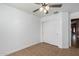 Bright bedroom with tile floors and spacious closet at 8714 W Heber Rd, Tolleson, AZ 85353