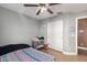 Bedroom with double bed, ceiling fan, and closet at 8714 W Heber Rd, Tolleson, AZ 85353