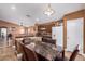 Kitchen boasts a granite island, dark cabinets, and breakfast nook at 8714 W Heber Rd, Tolleson, AZ 85353