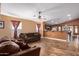 Open concept living room with kitchen view and tile floors at 8714 W Heber Rd, Tolleson, AZ 85353