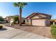 Single-story home with attached garage and desert landscaping at 8714 W Heber Rd, Tolleson, AZ 85353
