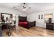 Large bedroom with dark wood bed frame and laminate flooring at 8714 W Heber Rd, Tolleson, AZ 85353