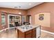 Eat-in kitchen with granite countertops and wood cabinets at 8714 W Heber Rd, Tolleson, AZ 85353