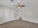Spacious bedroom with double door closet and ceiling fan at 8312 W Pioneer St, Tolleson, AZ 85353