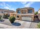 Two-story house with a two-car garage and landscaped yard at 8312 W Pioneer St, Tolleson, AZ 85353