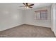 Bedroom with ceiling fan and window blinds at 8312 W Pioneer St, Tolleson, AZ 85353