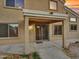 Covered patio with sliding glass doors and exterior lighting at 8312 W Pioneer St, Tolleson, AZ 85353