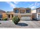 Two-story house with a two-car garage and landscaped yard at 8312 W Pioneer St, Tolleson, AZ 85353