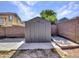 Grey metal storage shed in the backyard at 8312 W Pioneer St, Tolleson, AZ 85353